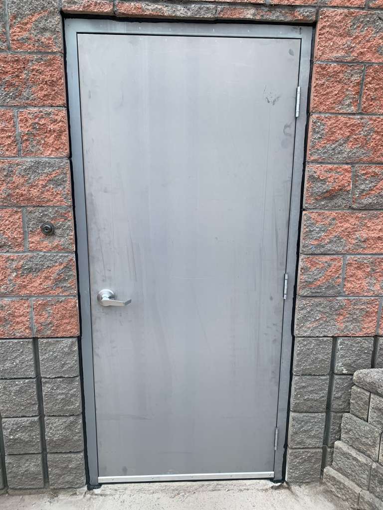 Exterior Insulated Commercial Hollow-Metal Door installation into Masonry Block Wall - Commercial Door Installation Services in Toronto/GTA & throughout Ontario - Ontario Commercial Doors Ltd.